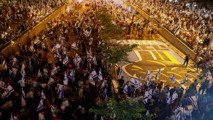 Israel’s Netanyahu taken to hospital for a heart procedure and placed under sedation as hundreds of thousands march in protest of his plans to overhaul the judiciary