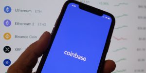 Coinbase stock dips after narrower loss for crypto company