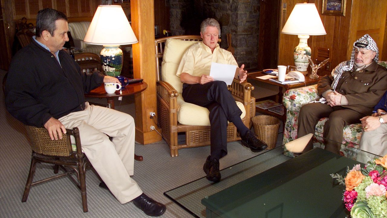US President Bill Clinton, center, speaks during a morning meeting with Israeli Prime Minister Ehud Barak, left, and Palestinian Chairman Yasser Arafat July 25, 2000 at Camp David in Maryland. Clinton announced later in the day that the Middle East peace summit had collapsed because of a deadlock over the status of the disputed city of Jerusalem. 
