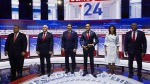 Trump speaks at auto plant as Republican rivals debate