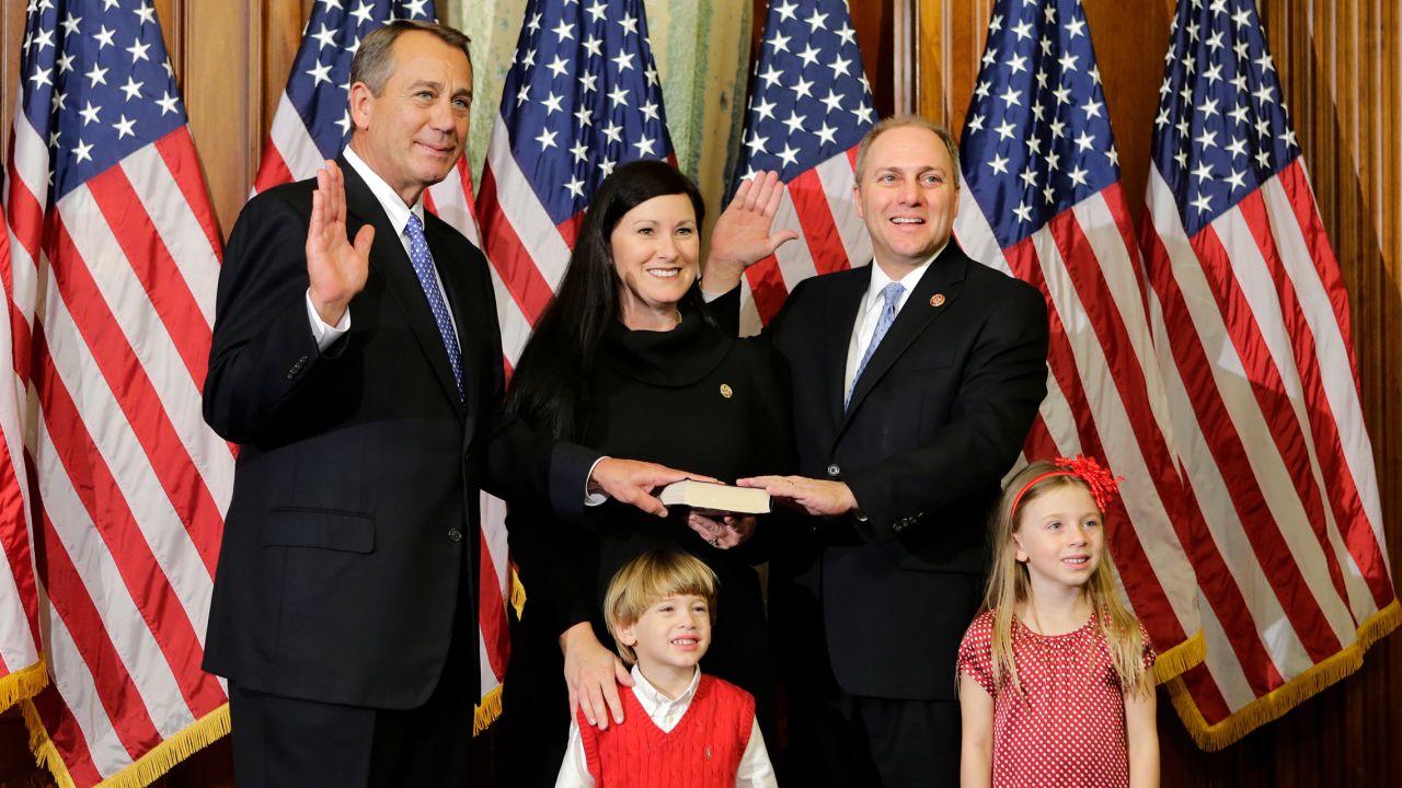 Rep. Steve Scalise stands with his family with Speaker of the House John Boehner in January 2013, in Washington.