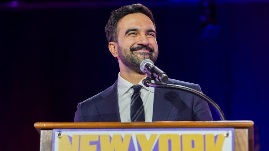 Zohran Mamdani speaks to voters.